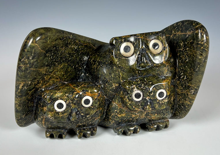 inuit stone carving of owls sitting together by artist Joanasie manning sculpture found at arctic raven gallery in friday harbor wa