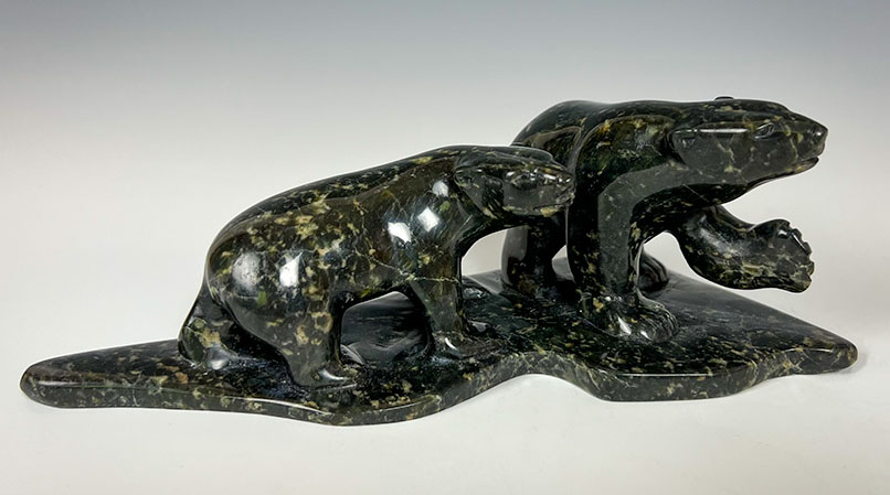 inuit stone carving of two bears by Quaraq Nungeosiak located at Arctic Raven gallery in Friday harbor WA